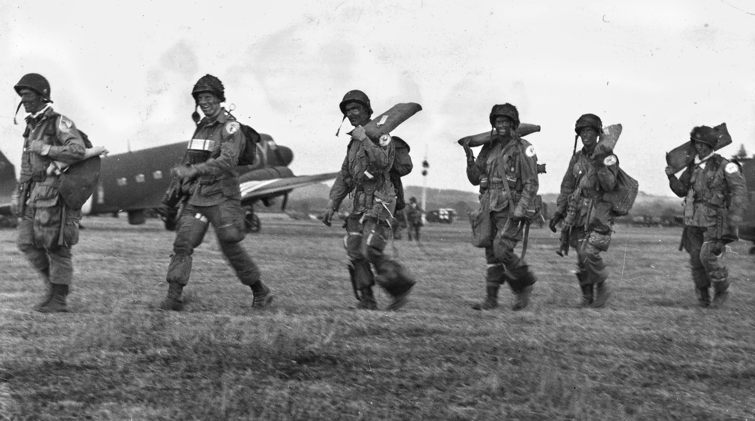 Paratroopers on their way to board their plane to fly into the Normandy Invasion 